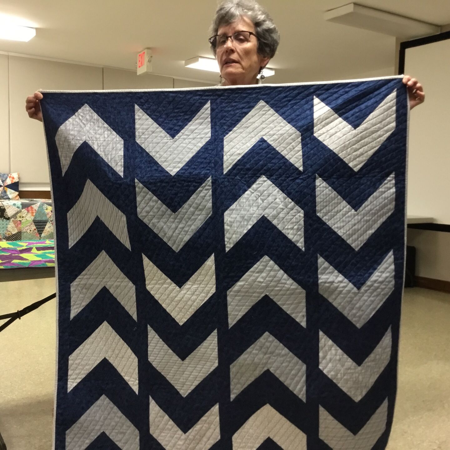 A custom chevron baby quilt by Sue Ouderkirk.